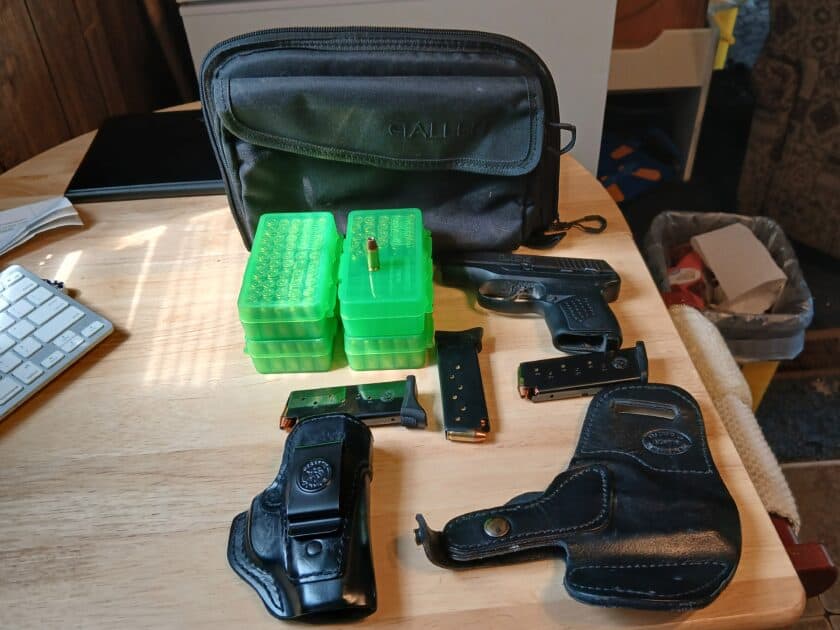 LC9 2 holsters 3 magazines 172 rds plunking ammo 21 rds defense ammo Pluss cases and gun case